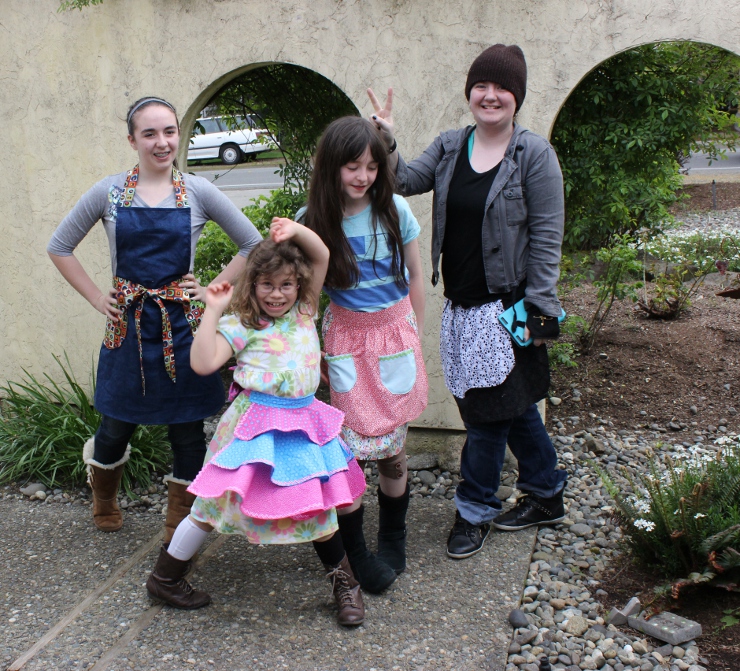 Four girls at Sew Maris Kids Sew Camp made aprons
