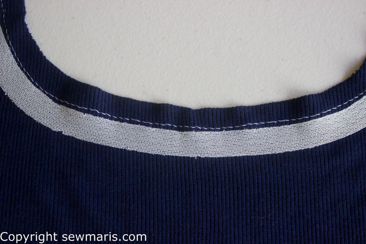 closeup of knit stay tape placement around neckline by Sew Maris
